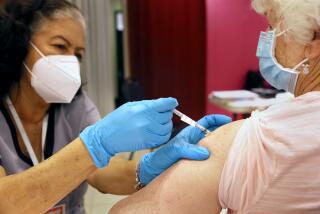 SAN RAFAEL, CALIFORNIA - APRIL 06: Registered Nurse Orlyn Grace (L) administers a COVID-19 booster vaccination to Jeanie Merriman (R) at a COVID-19 vaccination clinic on April 06, 2022 in San Rafael, California. The U.S. Food and Drug Administration has authorized a second COVID-19 booster of Pfizer-BioNTech and Moderna vaccines for people over 50 years old four months after their first booster. (Photo by Justin Sullivan/Getty Images)