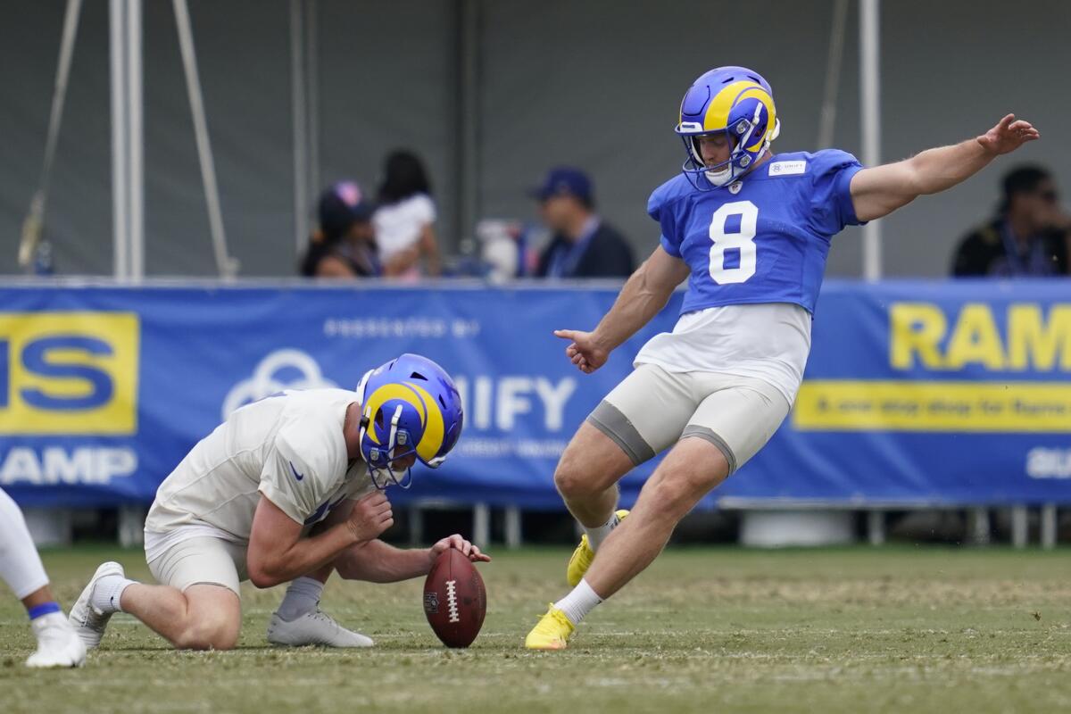 Rams kicker Matt Gay, right, participates in practice drills on Aug. 4.