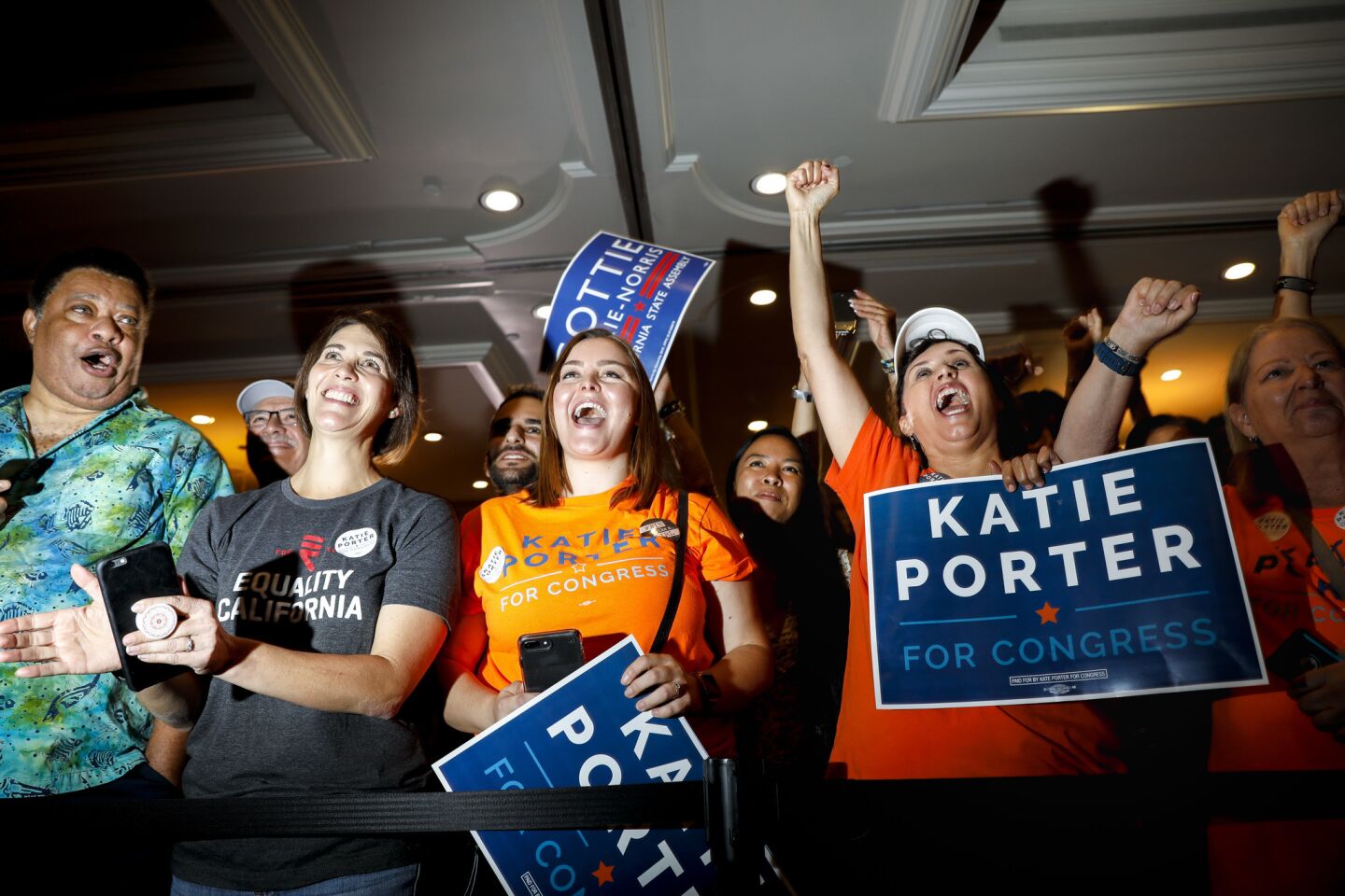 Supporters of Congressional candidate Katie Porter cheer at a rally attended by Sen. Kamala Harris and Chelsea Handler.