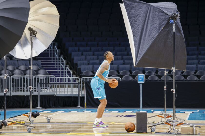 Charlotte Hornets P.J. Washington poses for a photographer during the NBA basketball team's media day in Charlotte, N.C., Monday, Sept. 26, 2022. (AP Photo/Nell Redmond)