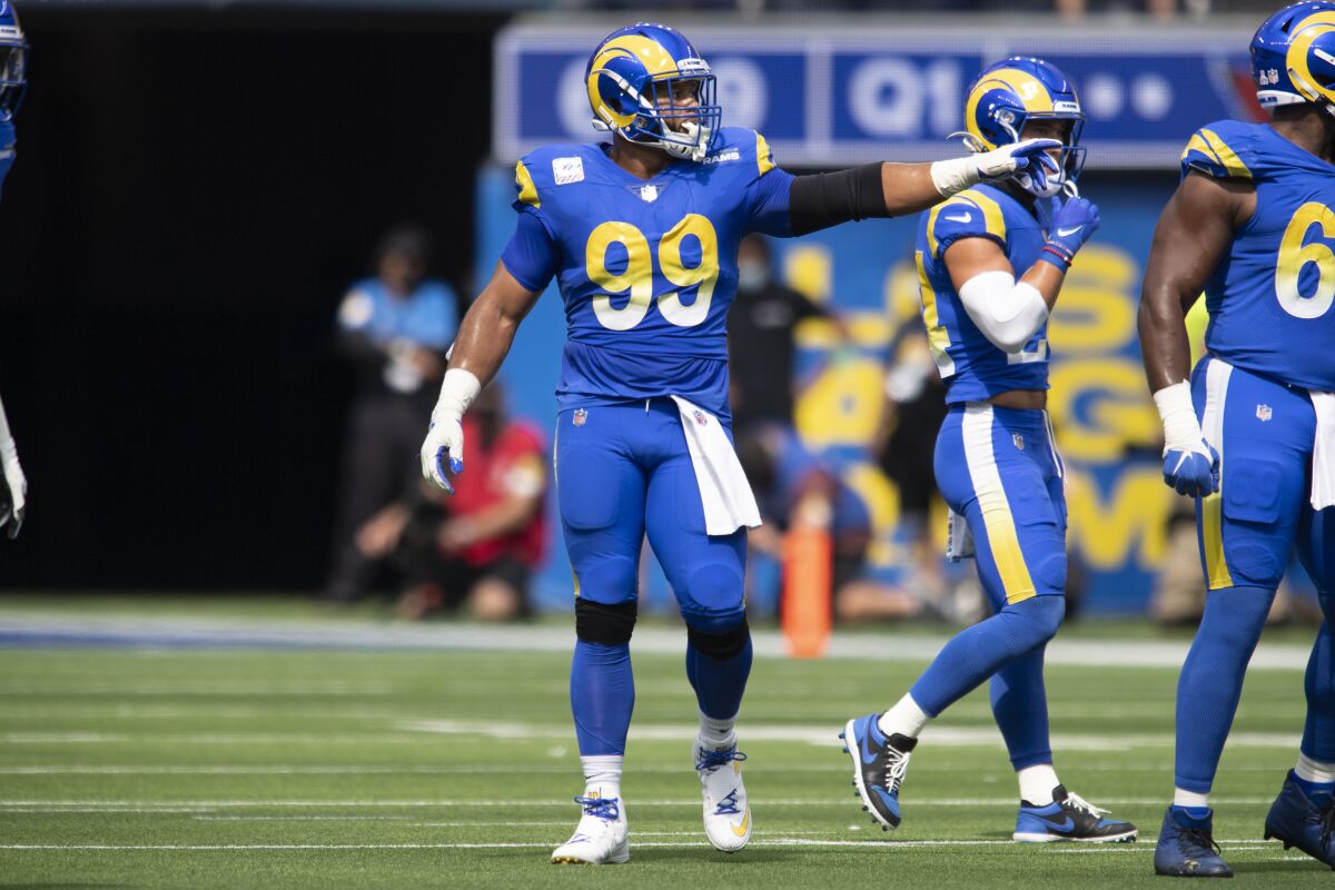 Rams defensive end Aaron Donald points across the line of scrimmage before a play against the Arizona Cardinals.