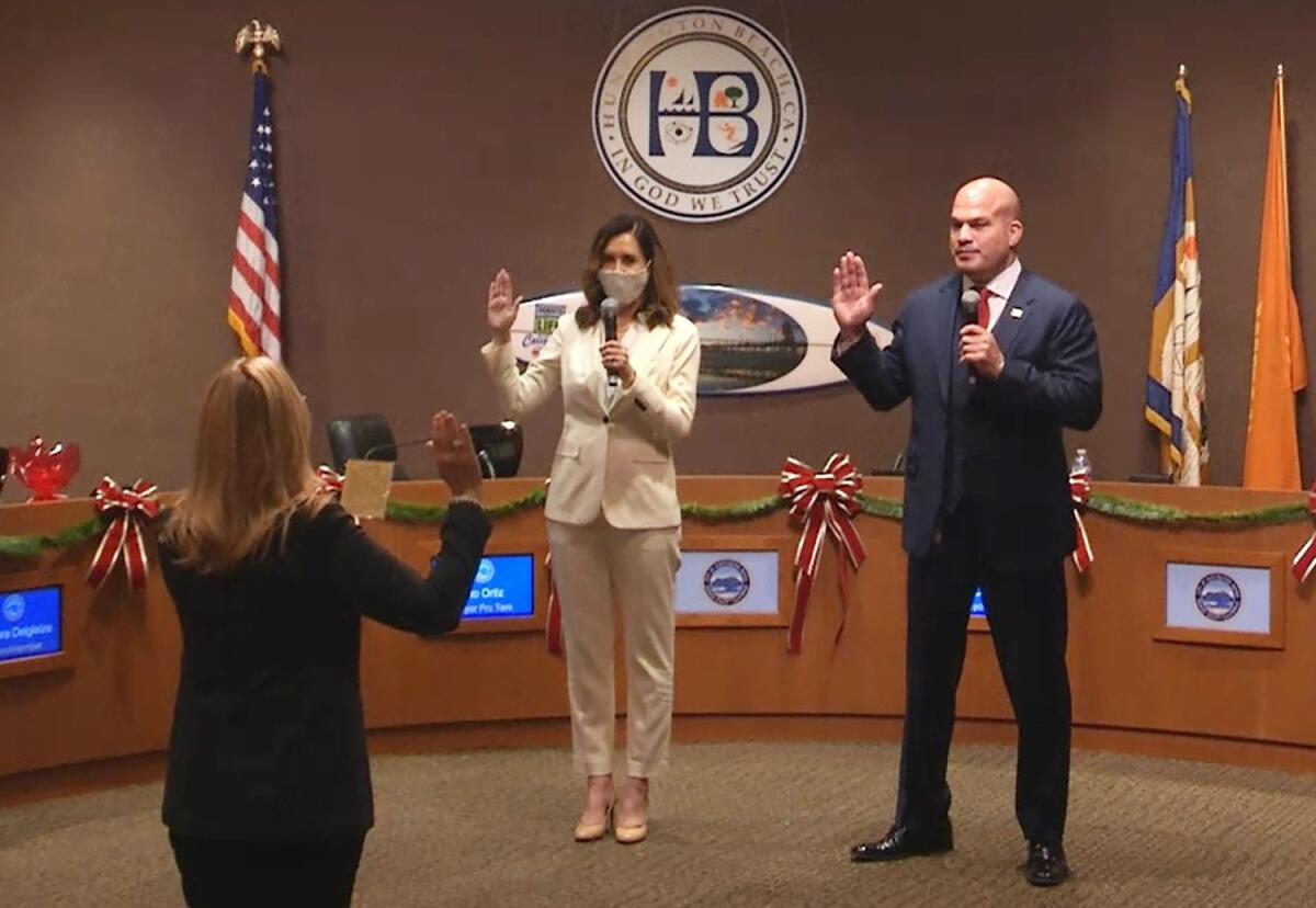 Kim Carr and Tito Ortiz take the oath of office