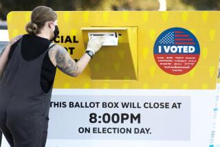 =A woman drops off her ballot at an Official Ballot Drop Box located near the Rose Bowl in Pasadena, CA October 13, 2020. =