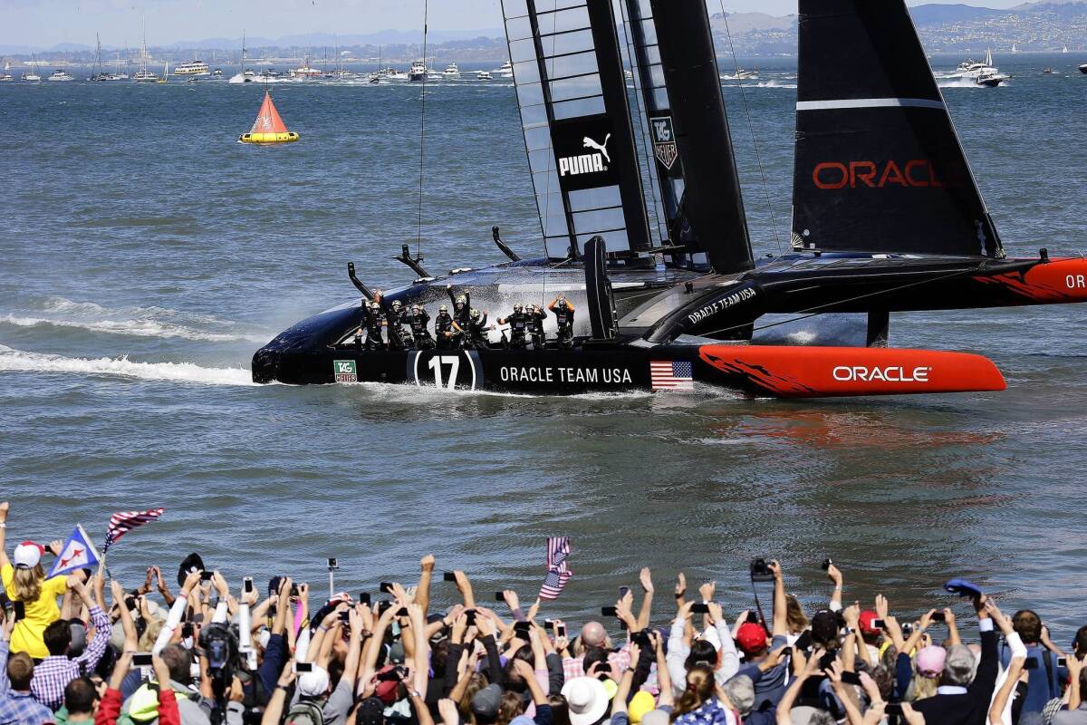 The crew on Oracle Team USA celebrates after winning the 19th race against Emirates Team New Zealand to win the America's Cup on Wednesday.