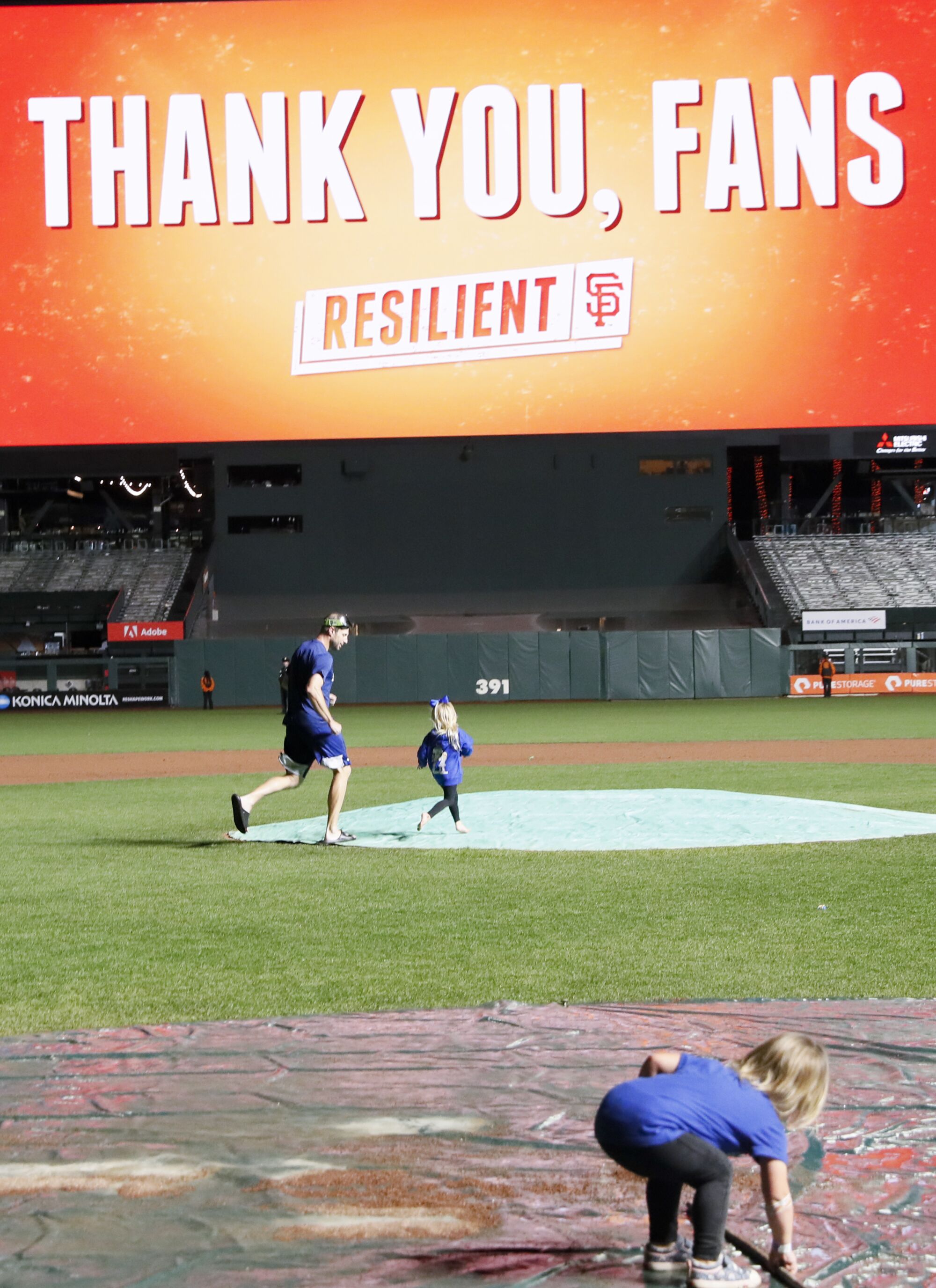  Los Angeles Dodgers' Max Scherzer chases his kids on the field after game five