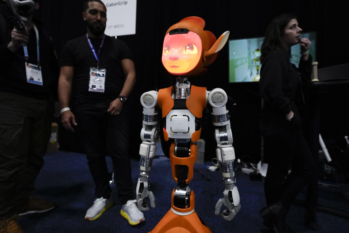 An orange and grey Mirokai robot by Enchanted Tools is seen during CES Unveiled before the start of the CES tech show