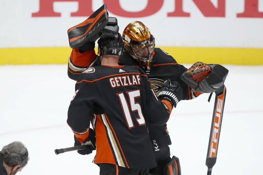 Anaheim Ducks center Ryan Getzlaf, left, congratulates goaltender Anthony Stolarz after the Ducks.