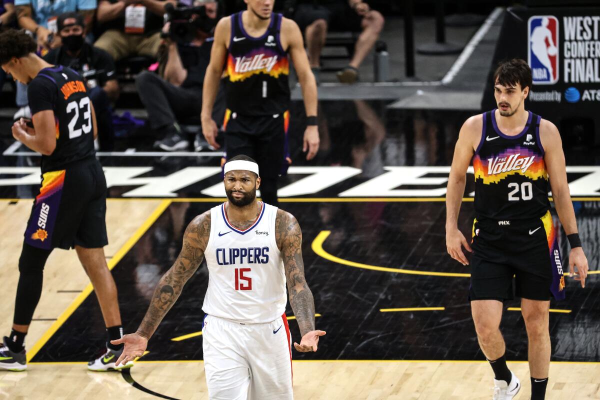 Clippers center DeMarcus Cousins grimaces and turns both palms upward in showing his frustration against Phoenix.