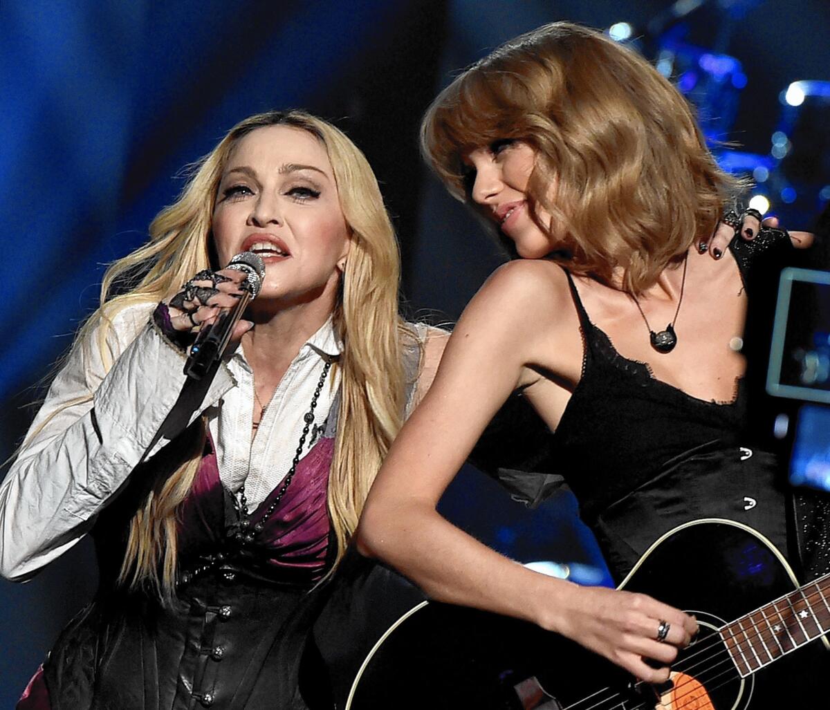 Madonna, left, and Taylor Swift perform "Ghost Town" during the 2015 iHeartRadio Music Awards at the Shrine Auditorium on March 29, 2015, in Los Angeles.
