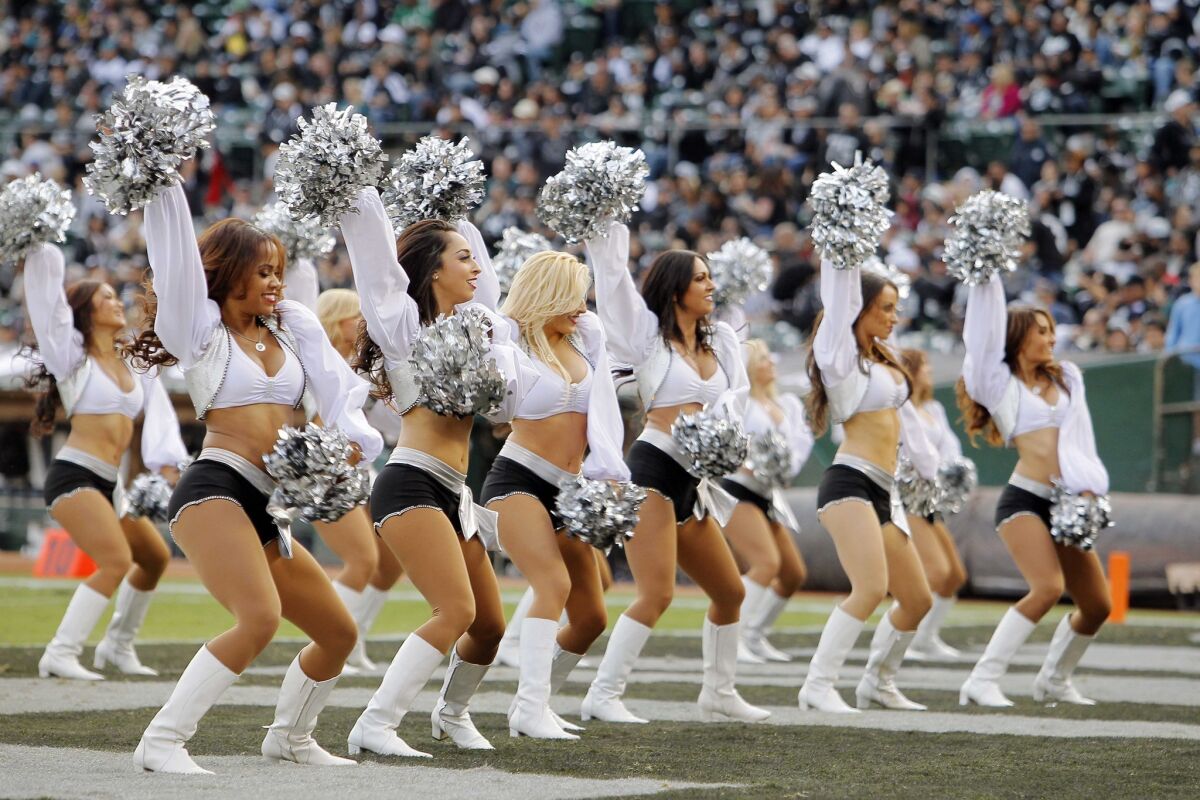 The Raiderettes dance during a timeout in a 2013 game at O.co Coliseum in Oakland.