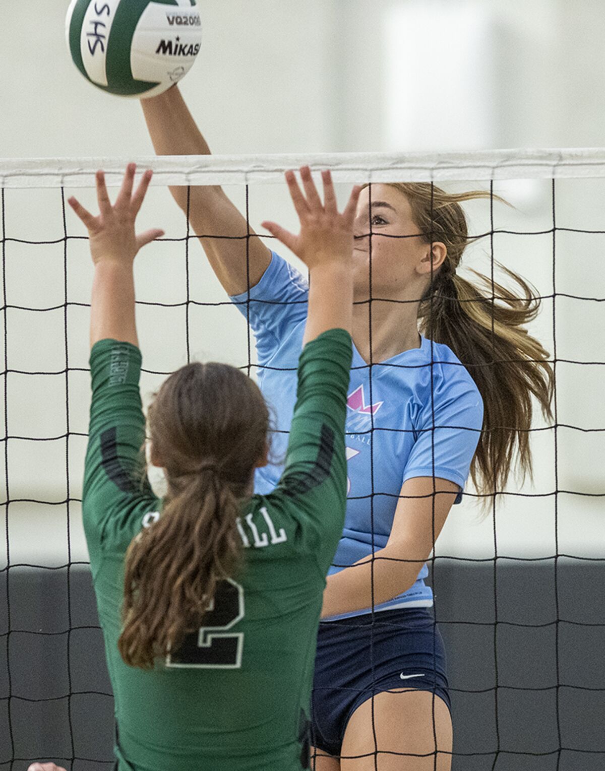 Corona del Mar's Sabrina Baker hits against Sage Hill's Claire Casey.
