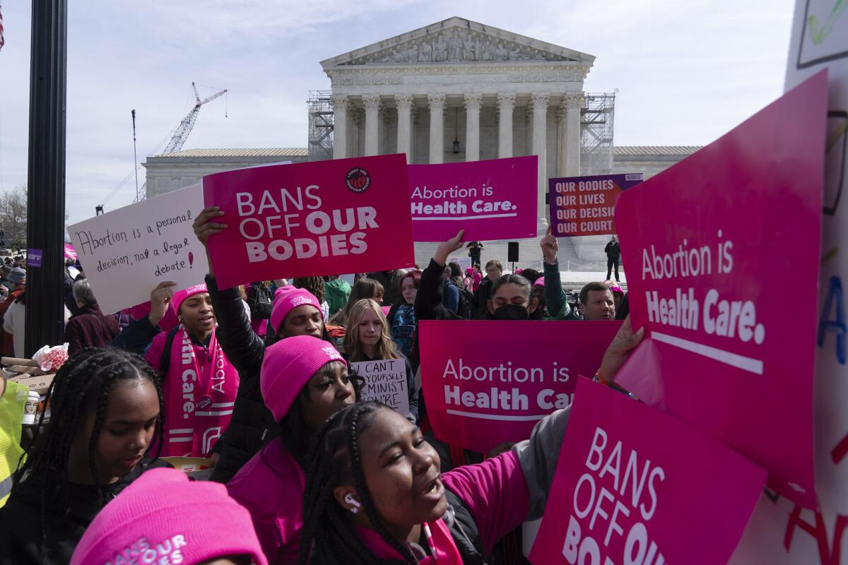 Abortion-rights activists rally outside the Supreme Court on March 26
