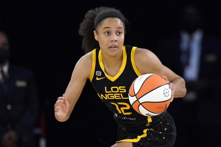 Los Angeles Sparks forward Nia Coffey dribbles during the first half of a WNBA basketball game against the Las Vegas Aces Friday, July 2, 2021, in Los Angeles. (AP Photo/Mark J. Terrill)