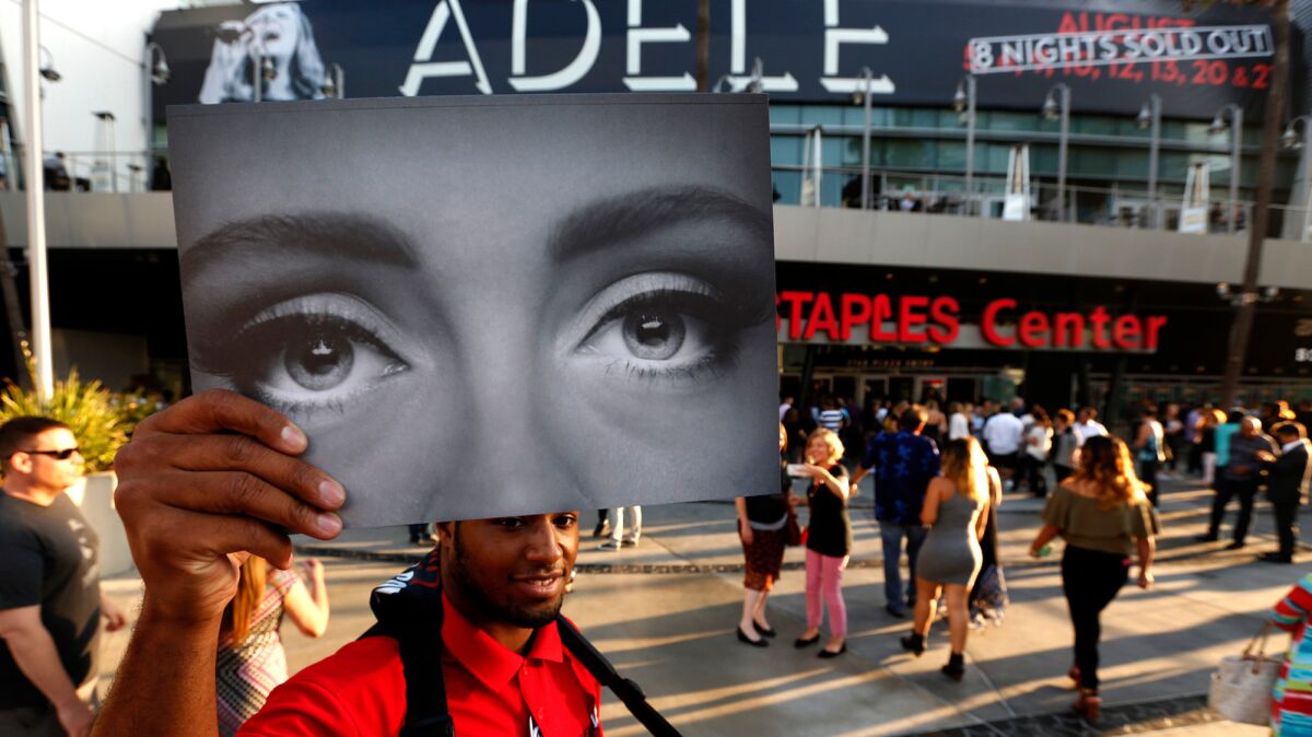 Elton Rodgers, 25, sells Adele programs on the first day of her eight night sold out run at Staples Center.