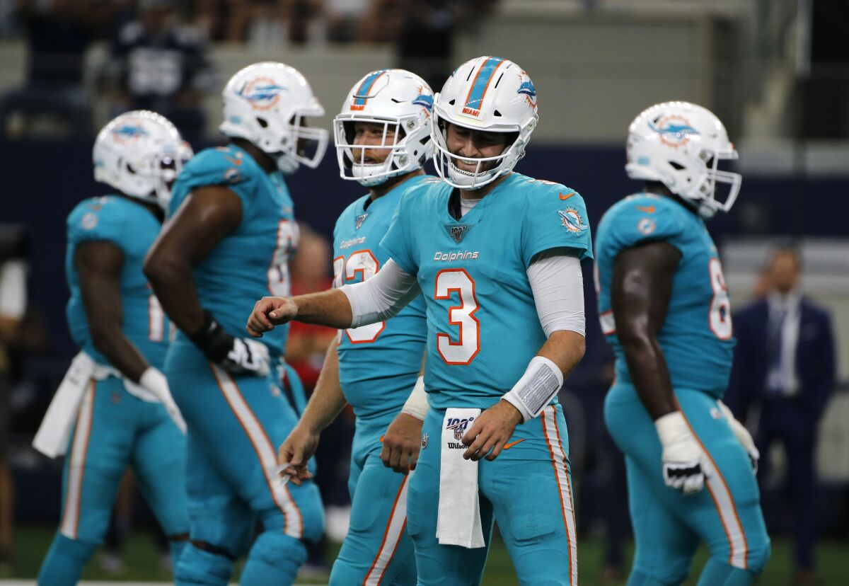 Miami Dolphins' Josh Rosen gestures after the Dolphins were charged with a false start penalty in the second half against the Dallas Cowboys in Arlington, Texas on Sept. 22.