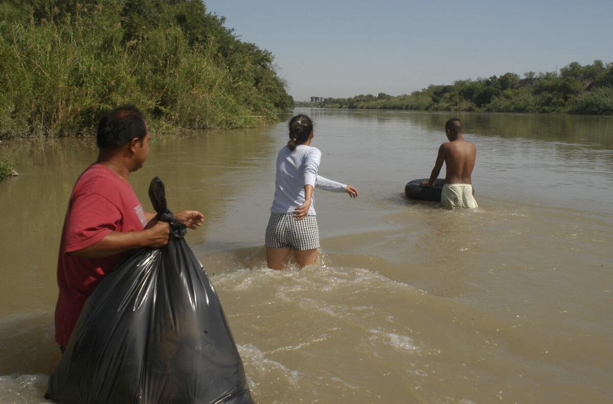 Migrants cross the Rio Grande, with the help of smugglers, in an attempt to reach the U.S. from Nuevo Laredo, Mexico.