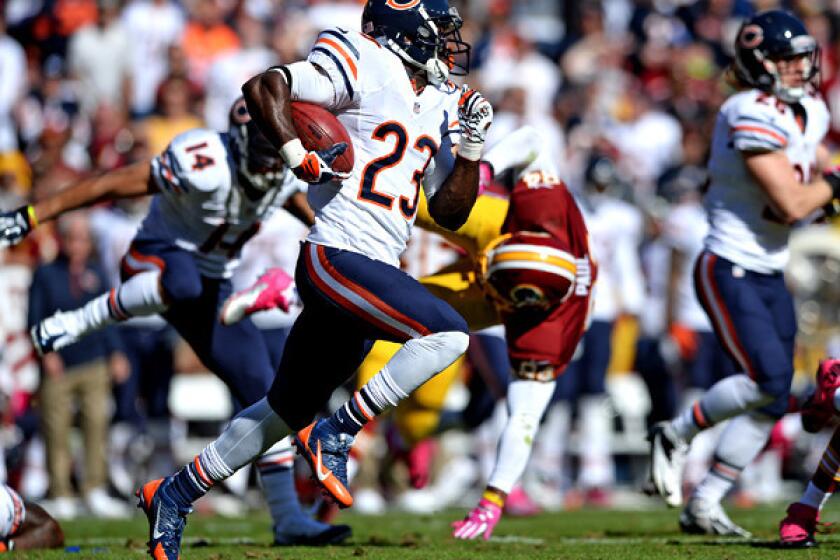 Bears receiver Devin Hester returns a punt 81 yards for a touchdown against the Washington Redskins in the second quarter at FedExField on Sunday, extending his NFL record to 13 punt returns for touchdowns.
