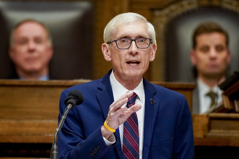 FILE — Wisconsin Gov. Tony Evers addresses a joint session of the Legislature in the Assembly chambers during the governor's State of the State speech at the state Capitol Tuesday, Feb. 15, 2022, in Madison, Wis. Behind Evers is Assembly Speaker Robin Vos, left, R-Rochester, and Senate President Chris Kapenga, R-Delafield. The Republican-controlled Wisconsin Legislature plans to send a dozen election and voting bills to Evers in an attempt to mollify backers of former President Donald Trump who falsely believe the 2020 election was stolen from him. (AP Photo/Andy Manis, File)