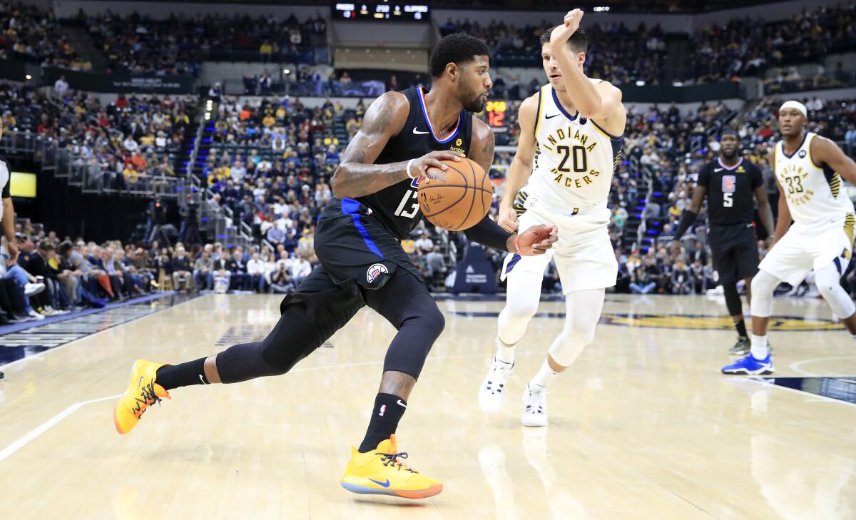 INDIANAPOLIS, INDIANA - DECEMBER 09: Paul George #13 of the Los Angeles Clippers dribbles the ball against the Indiana Pacers at Bankers Life Fieldhouse on December 09, 2019 in Indianapolis, Indiana. NOTE TO USER: User expressly acknowledges and agrees that, by downloading and or using this photograph, User is consenting to the terms and conditions of the Getty Images License Agreement. (Photo by Andy Lyons/Getty Images) ** OUTS - ELSENT, FPG, CM - OUTS * NM, PH, VA if sourced by CT, LA or MoD **