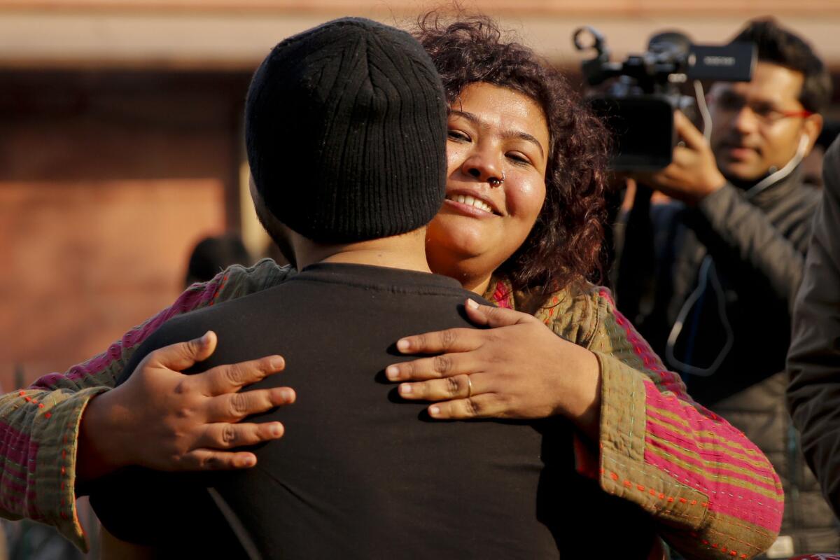 Gay rights supporters celebrate outside the Supreme Court after India's top court agreed to re-examine a colonial-era law that criminalizes homosexual acts in New Delhi, India, Tuesday, Feb. 2, 2016.