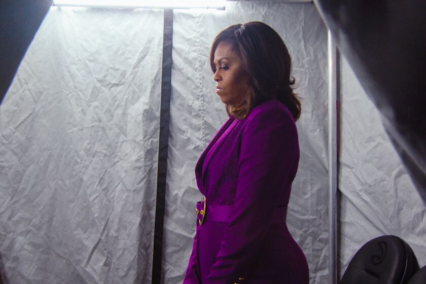 Michelle Obama waits backstage on her 2019 book tour in a scene from the Netflix documentary "Becoming."