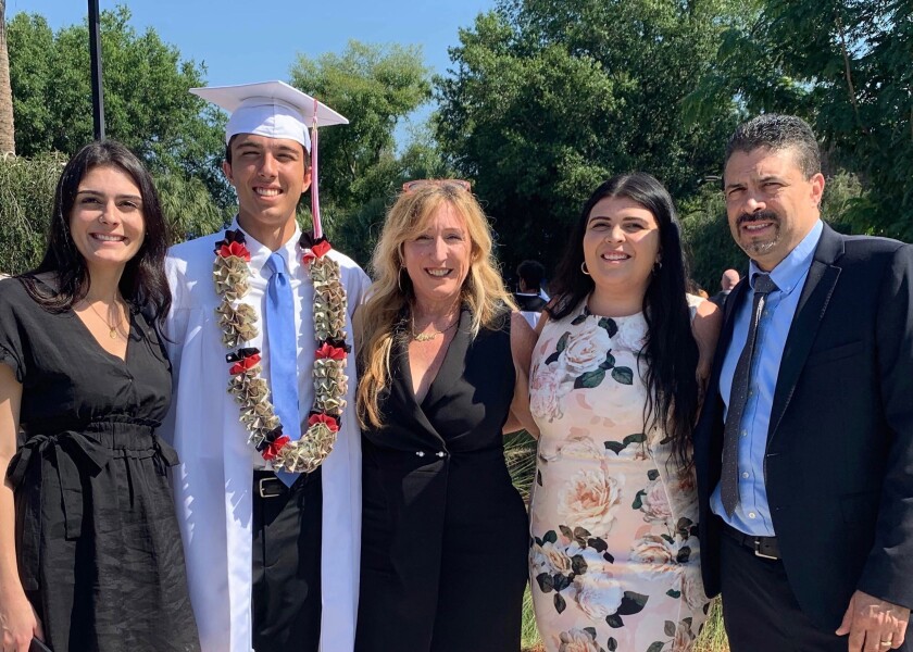 Dylan Hernandez and his family at his high school graduation in Florida.
