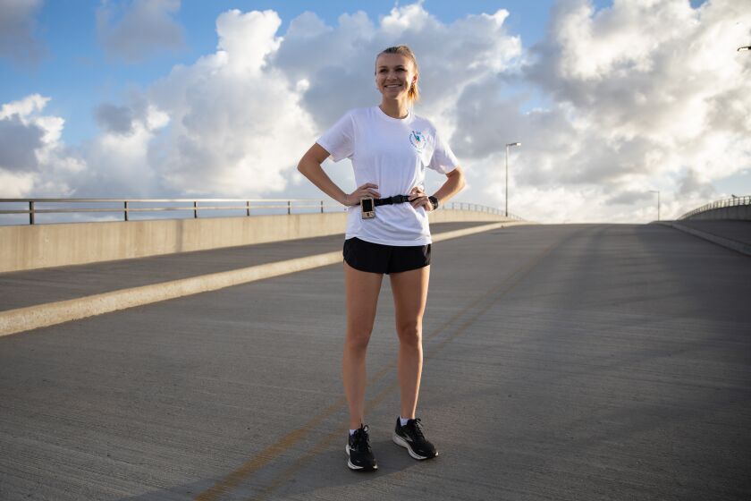 San Diego, CA - November 03: Dana Simmons poses for a portrait near the USS Recruit Monument at Liberty Station in San Diego, CA on Thursday, Nov. 3, 2022. Simmons, who was diagnosed with Type I diabetes at the age of 11, will participate in the 2022 TCS New York City Marathon. (Adriana Heldiz / The San Diego Union-Tribune)