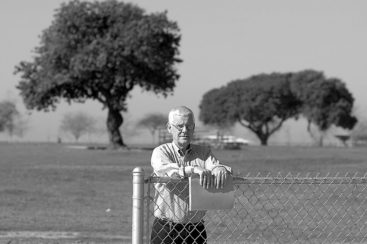 Gordon Bowley stands next to the Estancia High School track and football practice field in 2005.