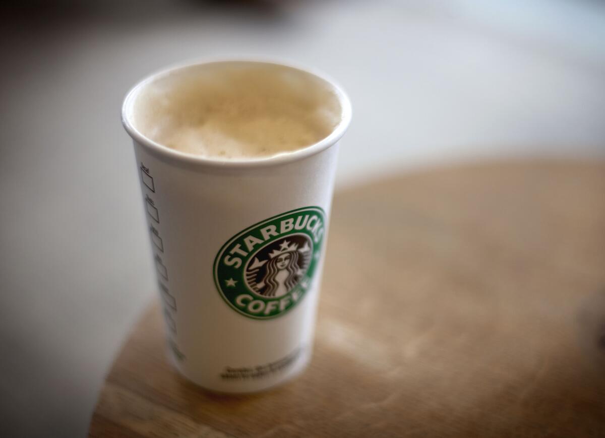 Starbucks expands its loyalty program, buys its first coffee farm and talks acquisitions in its annual investor meeting.