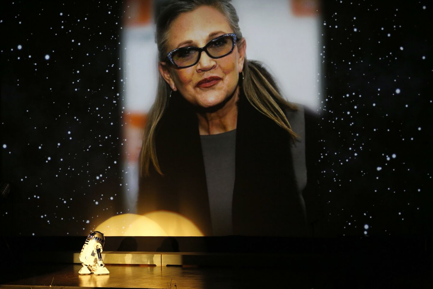 R2-D2 says goodbye under a giant photograph of Carrie Fisher during the memorial for Debbie Reynolds and Carrie Fisher at the Forest Lawn Memorial-Park in the Hollywood Hills.