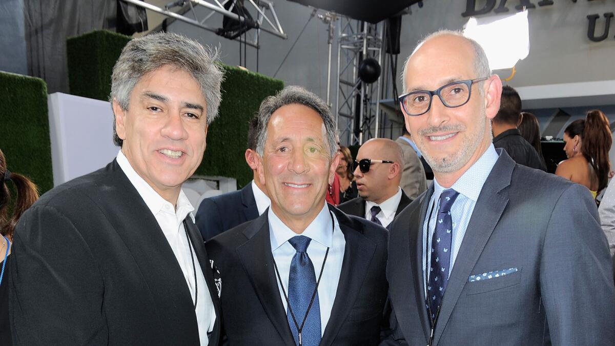 "We're going hard for Saturday nights," Telemundo President Luis Silberwasser, right, told The Times. "There's now a void there." Pictured with him are Mario Ruiz, left, senior vice president, talent at Telemundo; and Joe Uva, chairman, Hispanic Enterprises and Content, NBCUniversal.