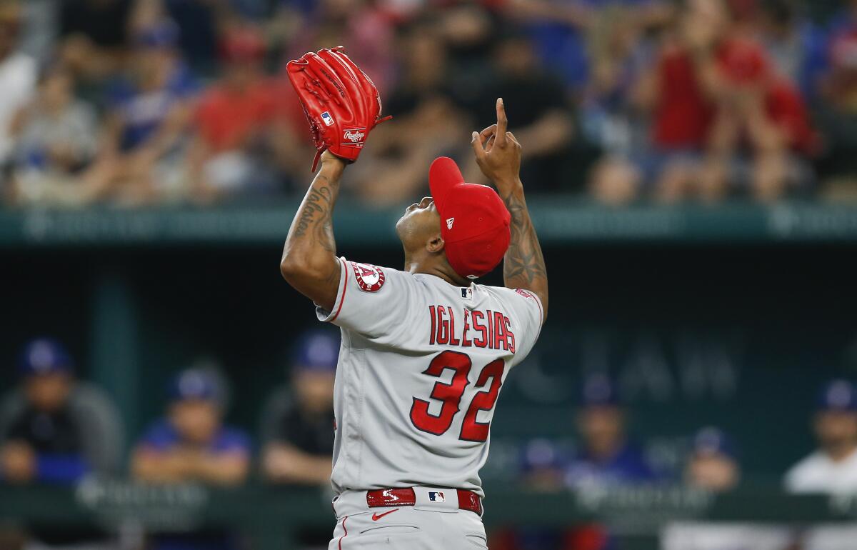 Angels relief pitcher Raisel Iglesias points skyward in celebration of a 5-0 win over the Texas Rangers