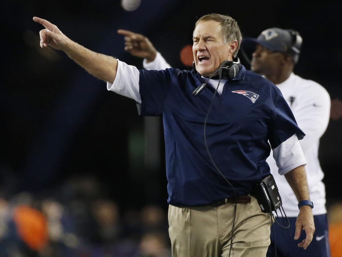 New England Coach Bill Belichick signals from the sideline Thursday against Miami.