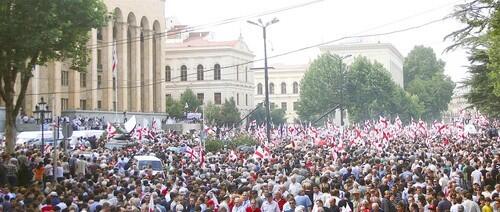Around 50,000 Georgians rally in front of the parliament building in central Tbilisi.