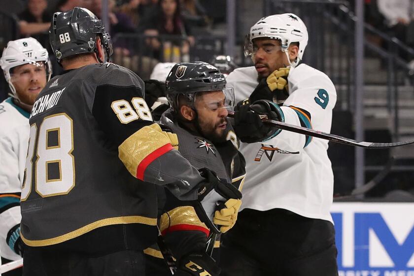 GLENDALE, NV - APRIL 26: Evander Kane #9 of the San Jose Sharks corss-checks Pierre-Edouard Bellemare #41 of the Vegas Golden Knights in the third period Game One of the Western Conference Second Round during the 2018 NHL Stanley Cup Playoffs at T-Mobile Arena on April 26, 2018 in Las Vegas, Nevada. The Golden Knights defeated the Sharks 7-0. (Photo by Christian Petersen/Getty Images) ** OUTS - ELSENT, FPG, CM - OUTS * NM, PH, VA if sourced by CT, LA or MoD **