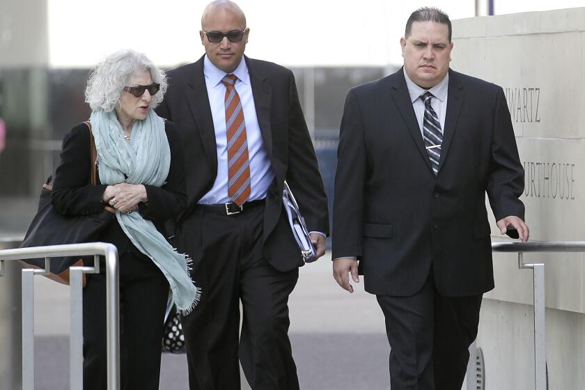 San Diego, CA_11/20/2013_Navy Commander Jose Luis Sanchez arrived at federal court for an appearance at 10:30 a.m. in the Navy bribery scandal. He is on right, walking with attorneys Nancy Hollander, left, and Vincent Ward.Photo by John Gastaldo/U-T San Diego/Mandatory Credit: John Gastaldo/U-T San Diego/Zuma Press