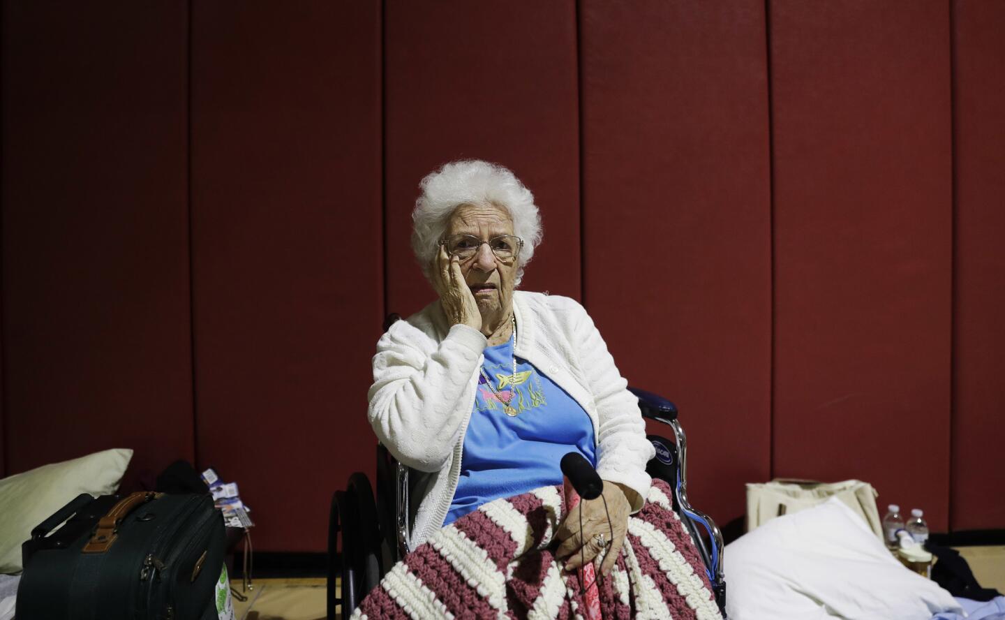 Mary Della Ratta, 94, sits in a shelter Sept. 10, 2017, after evacuating her home in Naples, Fla., with the help of police ahead of Hurricane Irma. "I'm afraid of what's going to happen. I don't know what I'll find when I go home," said Della Ratta, whose husband died 10 years ago. "I have nobody. I'm all alone in this world."