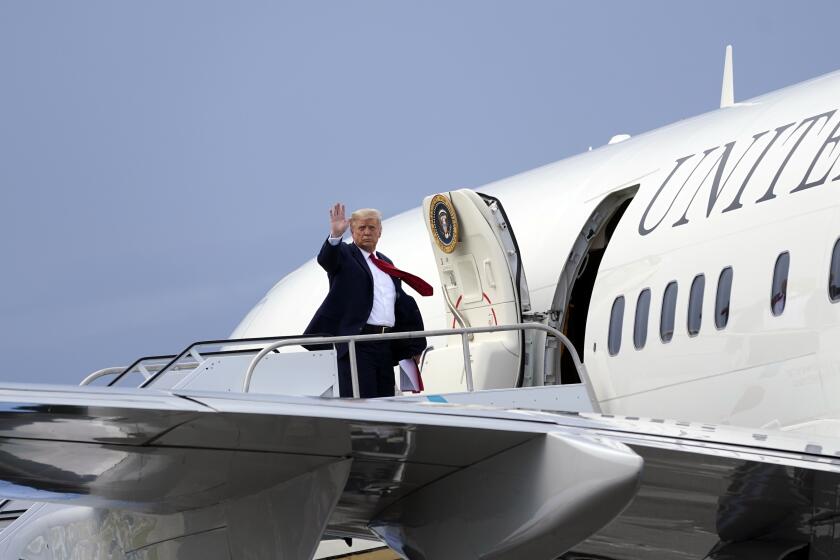 President Trump boards Air Force One at West Palm Beach (Fla.) International Airport on Tuesday.