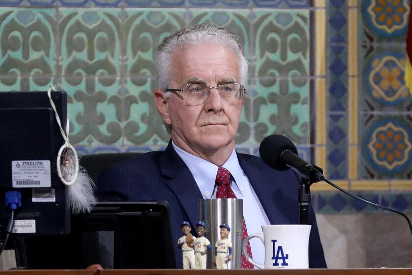 LOS ANGELES, CA - JUNE 14: Los Angeles City Council President Paul Krekorian listens to public comment in the Council Chambers after holding a press conference responding to charges against City Councilman Curren Price, at City Hall in downtown on Wednesday, June 14, 2023 in Los Angeles, CA. Los Angeles City Councilmember Curren Price was charged with 10 counts of embezzlement, perjury and conflict of interest. (Gary Coronado / Los Angeles Times.