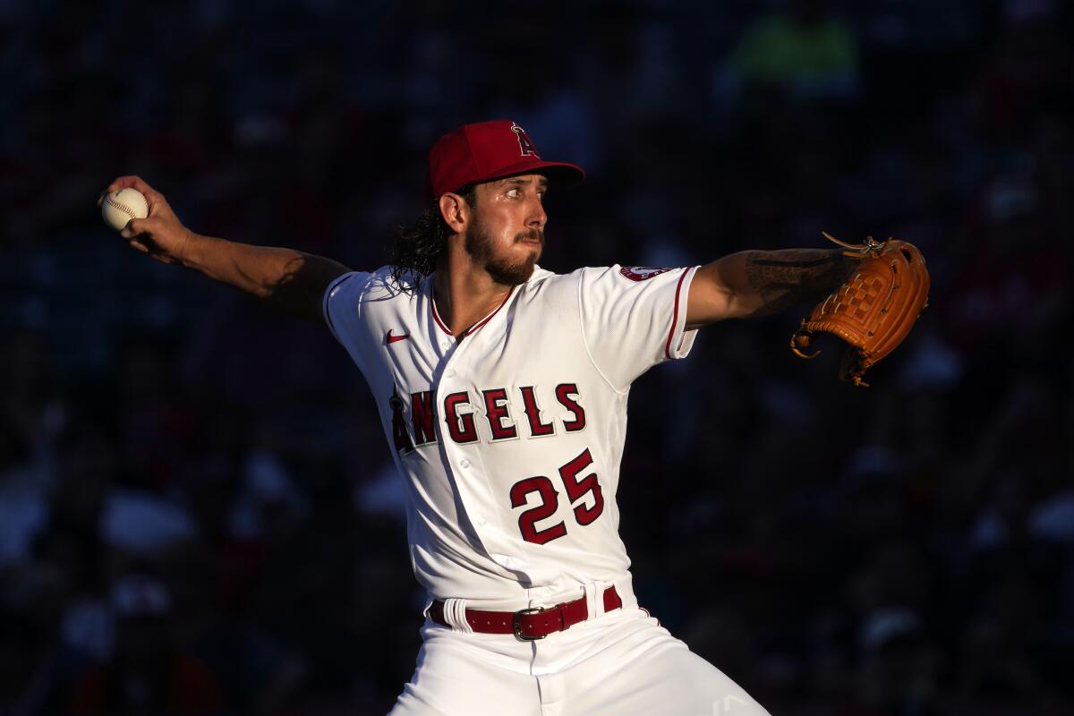 Angels pitcher Michael Lorenzen throws to the plate against the Seattle Mariners.