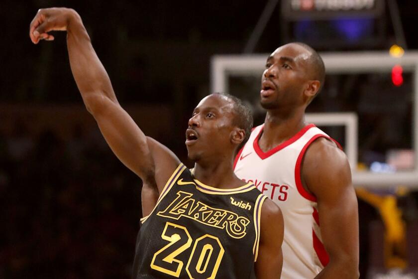 LOS ANGELES, CALIF. - APR. 10, 2018. Lakers guard Andre ingram follows through on a three-point shot against the Rockets in the second quarter Tuesday, April 10, 2017, at Staples Center in Los Angeles. (Luis Sinco/Los Angeles Times)