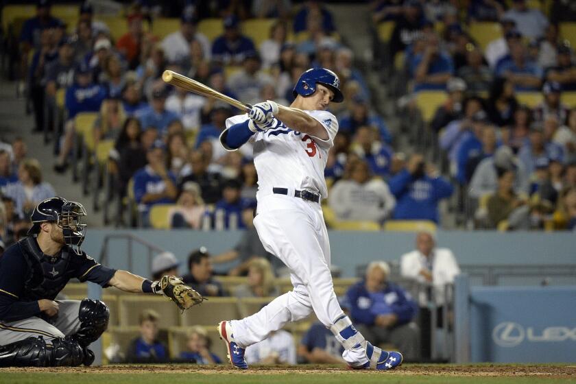 Dodgers center fielder Joc Pederson, breaking up Brewers starter Jimmy Nelson's no-hitter in the sixth inning, drove in the winning run with a double in the seventh inning Friday night.