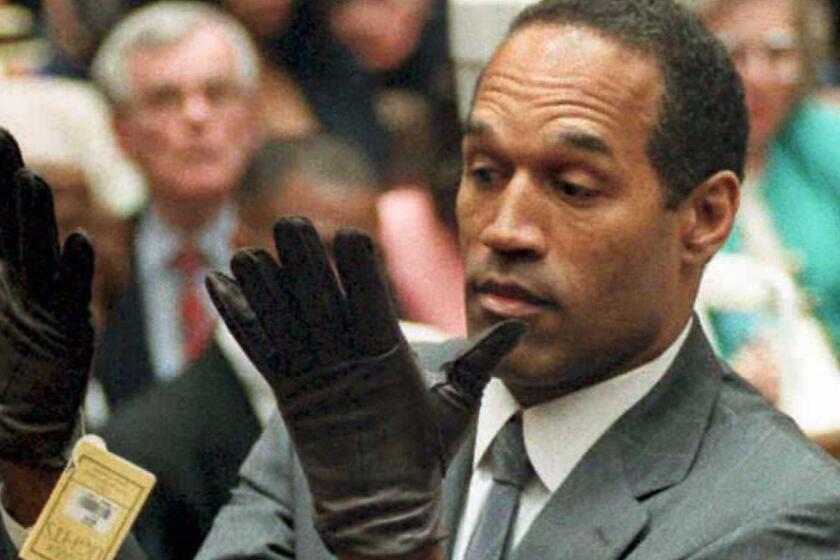 (FILES) This June 21, 1995 file photo shows former US football player and actor O.J. Simpson looking at a new pair of Aris extra-large gloves that prosecutors had him put on during his double-murder trial in Los Angeles. Former American football star O.J. Simpson has spent nearly nine years in prison. Not for the grisly 1994 murders of his ex-wife and a male companion -- he was famously acquitted in that case.No, Simpson has been behind bars for his role in a September 2007 armed robbery of twosports memorabilia dealers at a Las Vegas resort.He could soon go free. A Nevada parole board will hold a hearing in Carson City on July 20, 2017 to decide whether the former National Football League (NFL) star and actor should be released from prison. / AFP PHOTO / VINCE BUCCIVINCE BUCCI/AFP/Getty Images ** OUTS - ELSENT, FPG, CM - OUTS * NM, PH, VA if sourced by CT, LA or MoD **