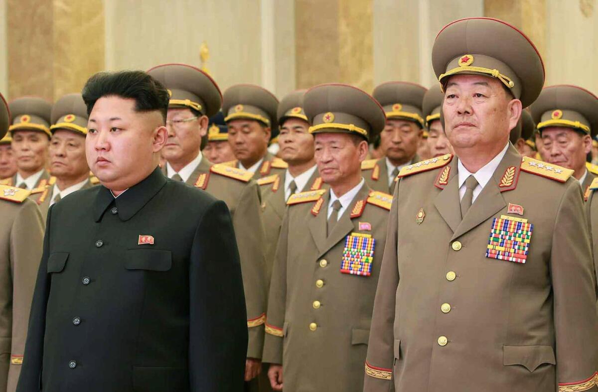 North Korean leader Kim Jong Un and Defense Minister Hyon Yong-chol stand at Kumsusan Palace in Pyongyang on Feb. 16.