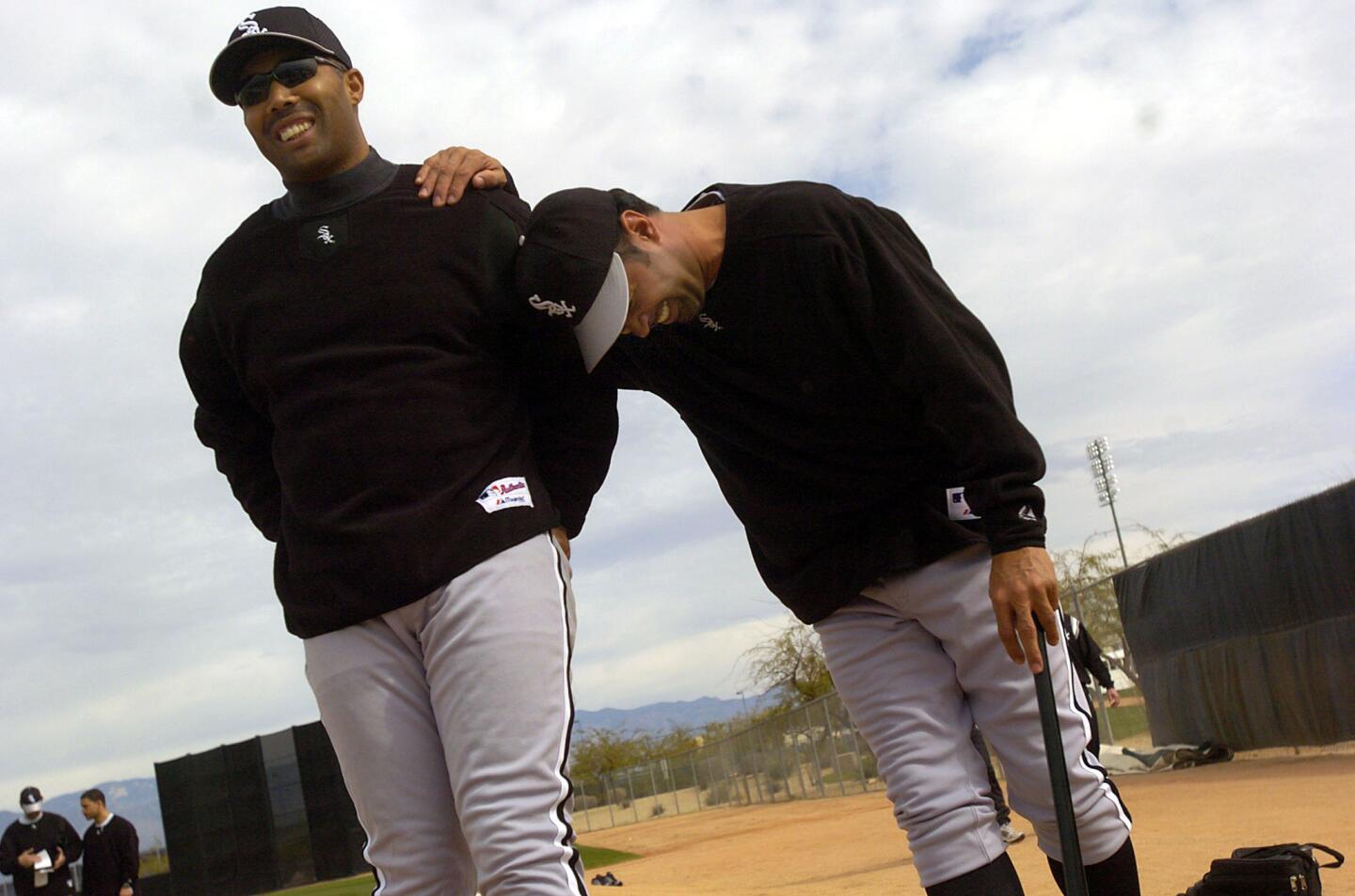 White Sox manager Ozzie Guillen with Harold Baines at spring training on Feb. 20, 2004.