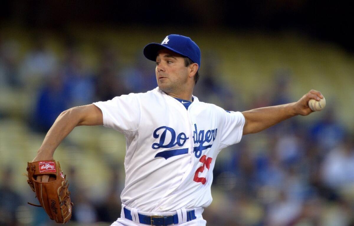 Dodgers starting pitcher Ted Lilly throws against the Colorado Rockies on April 29.