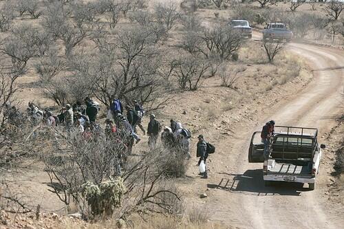 HOPING TO CROSS: On a dirt road that roughly parallels the border, a pickup lets out a group of migrants about seven miles east of Sasabe.