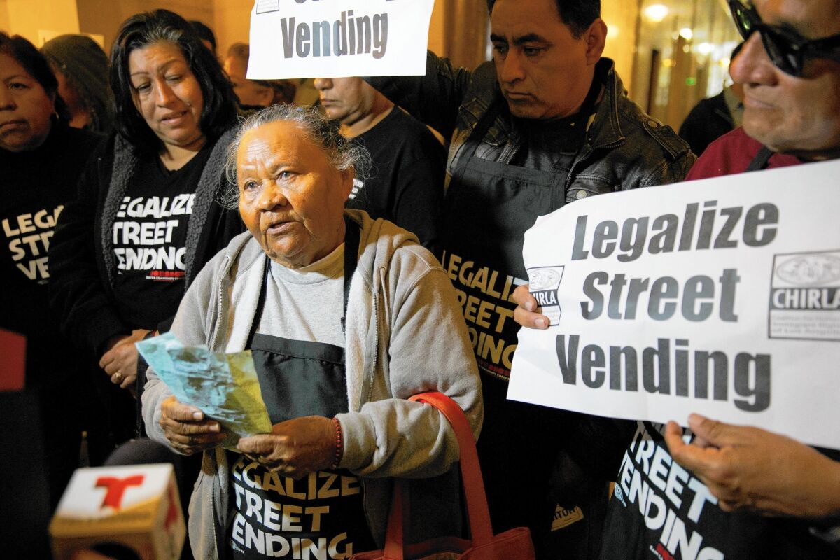 Street vendor Rosa Calderon, 85, shown at a rally Tuesday at City Hall, says she has been fined more than $1,500 in just a month.