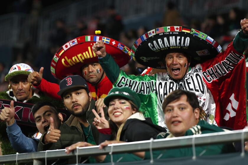 Fans of Mexico team cheer their team during the international friendly soccer match between Mexico and Sweden at the Montilivi municipal stadium in Girona, Spain, Wednesday, Nov. 16, 2022. (AP Photo/Joan Monfort)