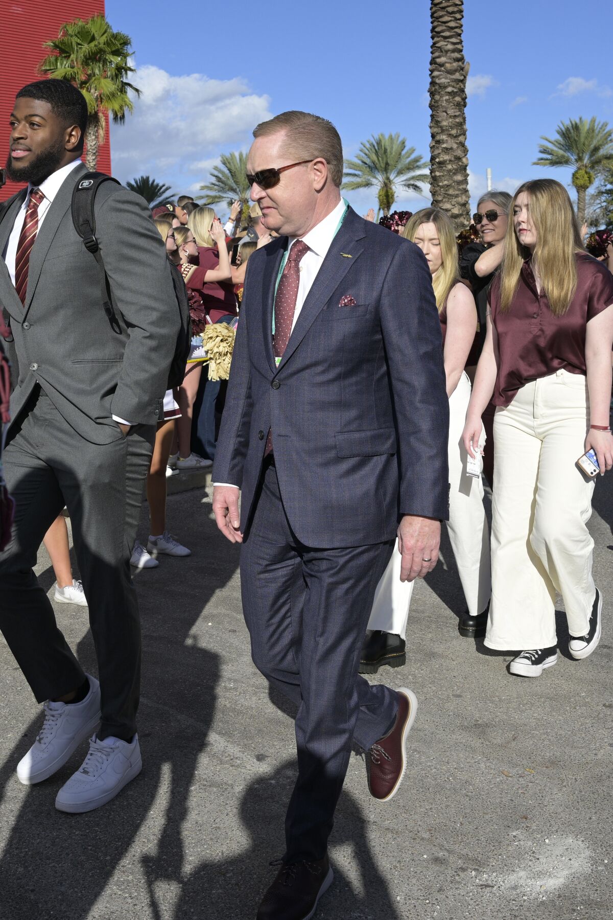 Florida State athletic director Michael Alford passes fans while walking into the stadium before the Cheez-It Bowl 